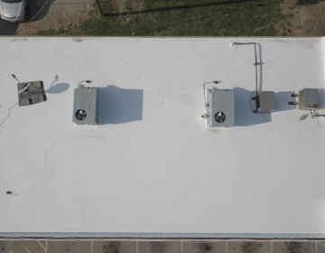top of a commercial building roof with multiple hvac units