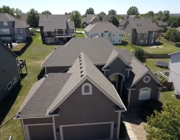 multiple residential homes with newly completed roof replacements and installations